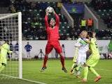 Gent's goalkeeper Matz 'The Bulge' Sels saves a ball during the second-leg round of 16 UEFA Champions League match against Wolfsburg and KAA Gent at the Volkswagen arena in Wolfsburg on March 8, 2016