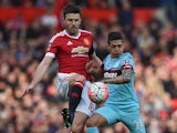 Michael Carrick and Manuel Lanzini in action during the FA Cup game between Manchester United and West Ham United on March 13, 2016