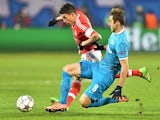 Nicolas Gaitan and Mauricio in action during the thrilling Champions League game between Zenit and Benfica on March 9, 2016