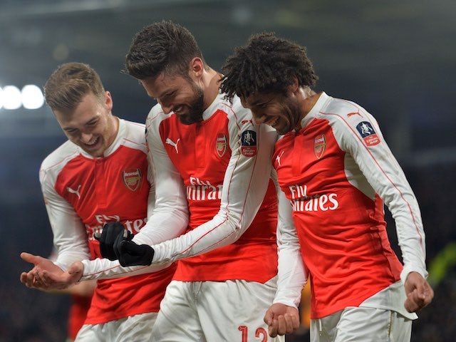 Olivier Giroud celebrates with Calum Chambers and Mohamed Elneny during the FA Cup game between Hull City and Arsenal on March 8, 2016
