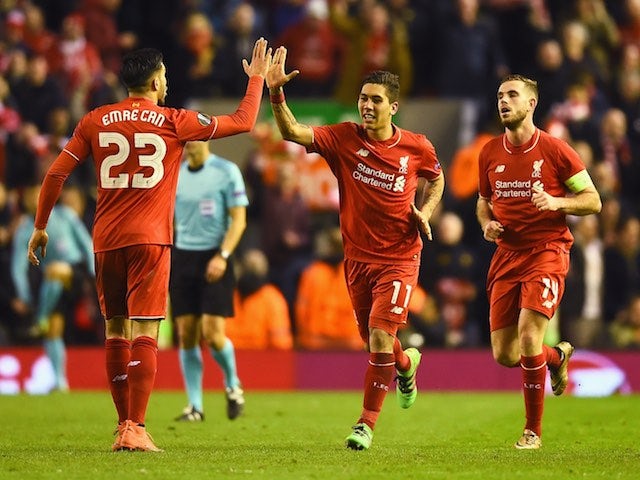 Roberto Firmino celebrates with Emre Can during the Europa League game between Liverpool and Manchester United on March 10, 2016
