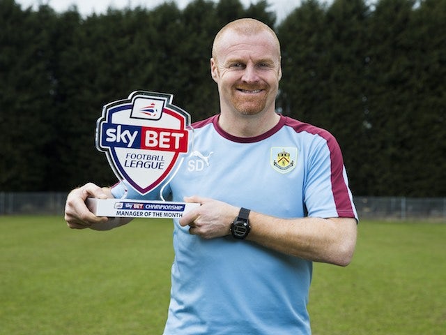 Sean Dyche poses very proudly with his manager of the month award for February 2016
