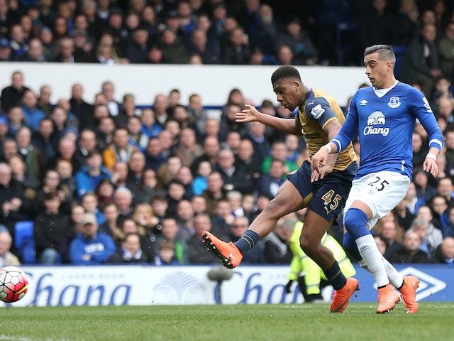 Alex Iwobi scores the Gunners' second during the Premier League game between Everton and Arsenal on March 19, 2016
