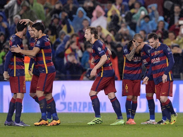 Barcelona players celebrate during the Champions League round-of-16 second leg against Arsenal on March 16, 2016