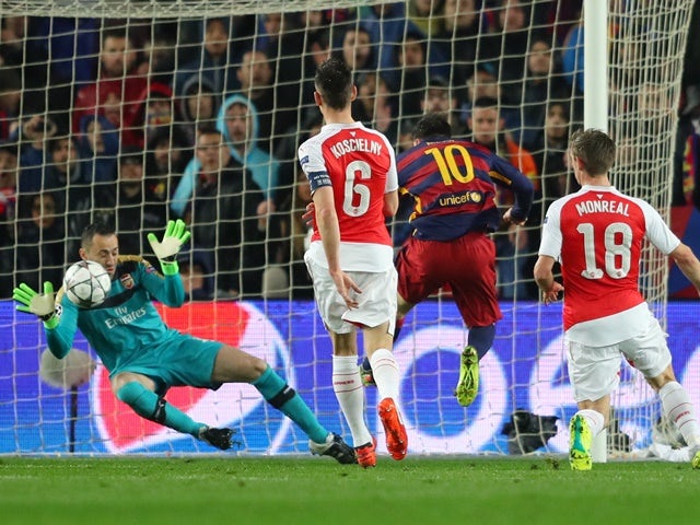 David Ospina saves a shot by Lionel Messi during the Champions League round-of-16 second leg between Barcelona and Arsenal on March 16, 2016