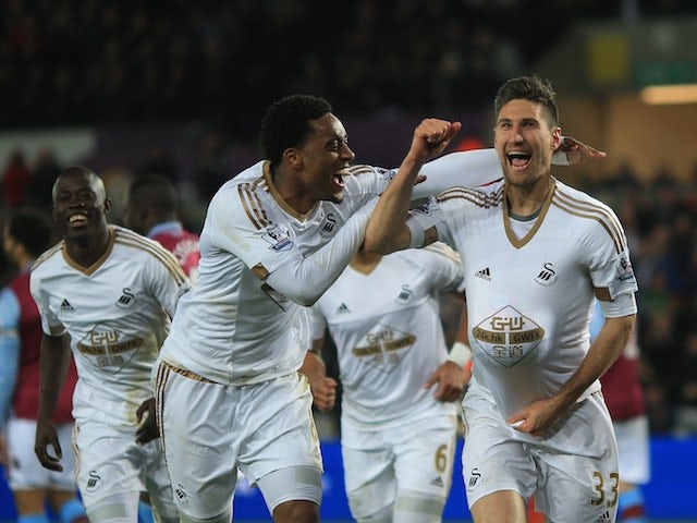 Federico Fernandez celebrates scoring with Leroy Fer during the Premier League game between Swansea City and Aston Villa on March 19, 2016