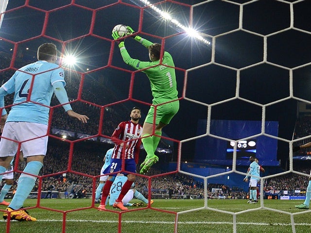 PSV Eindhoven's goalkeeper Jeroen Zoet stops a ball against Atletico Madrid on March 15, 2016