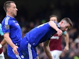 John Terry enjoys some inter-game fun with a shocked Gary Cahill during the Premier League game between Chelsea and West Ham United on March 19, 2016
