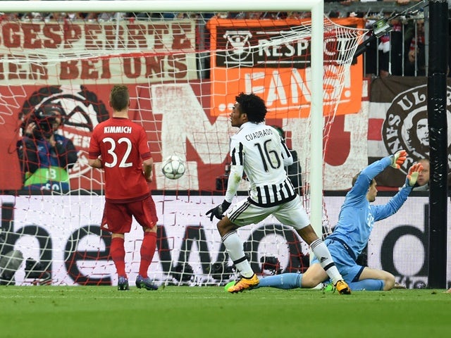 Juan Cuadrado scores the second goal during the Champions League round-of-16 second leg between Bayern Munich and Juventus on March 16, 2016