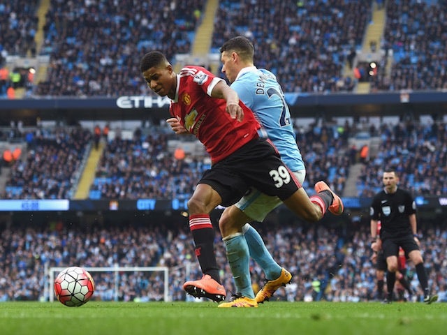 Martin Demichelis of Manchester City challenges Manchester United's Marcus Rashford on March 20, 2016