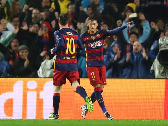 Neymar celebrates scoring the opening goal with Lionel Messi during the Champions League round-of-16 second leg between Barcelona and Arsenal on March 16, 2016