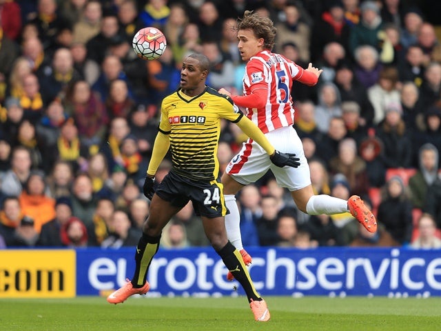 Odion Ighalo and Marc Muniesa in action during the Premier League match between Watford and Stoke City on March 19, 2016