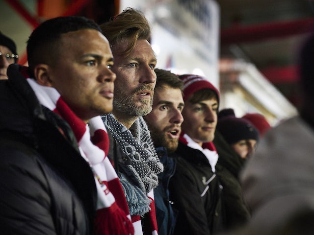 Robbie Savage watches an Accrington Stanley match on March 16, 2016