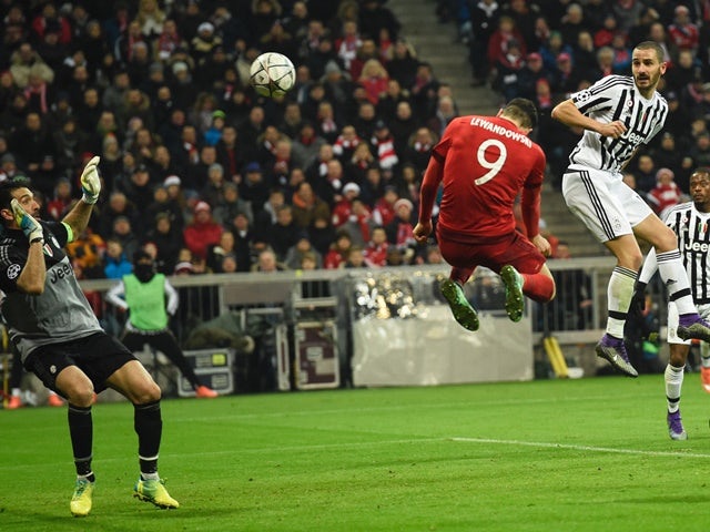 Robert Lewandowski scores with a header during the Champions League round-of-16 second leg between Bayern Munich and Juventus on March 16, 2016