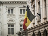 The Belgian flag flies at half mast following the Brussels attacks on March 23, 2016