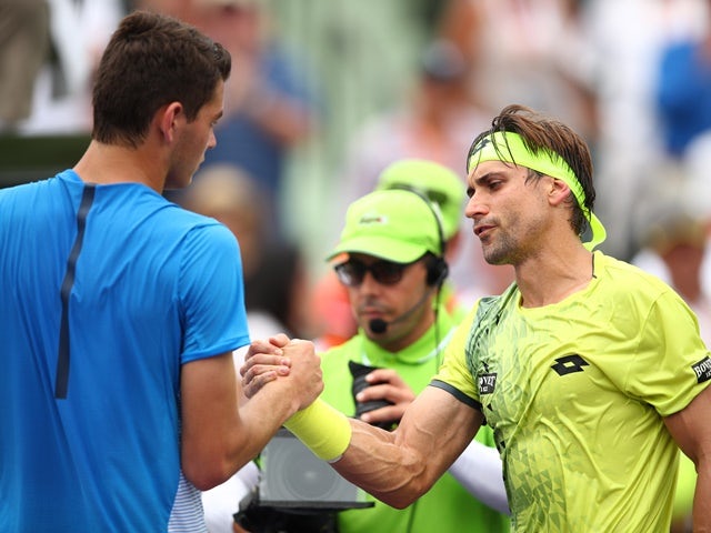 David Ferrer shakes hands at the net after his straight-sets victory against Taylor Fritz at the Miami Open on March 25, 2016