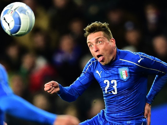 Italy's midfielder Emanuele Giaccherini auditions for Mary Poppins during the friendly against Spain at Friuli-Dacia Arena Stadium in Udine on March 24, 2016
