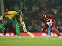 Denesh Ramdin of West Indies successfully runs out South Africa's batsman Hashim Amla during the World T20 on March 25, 2016