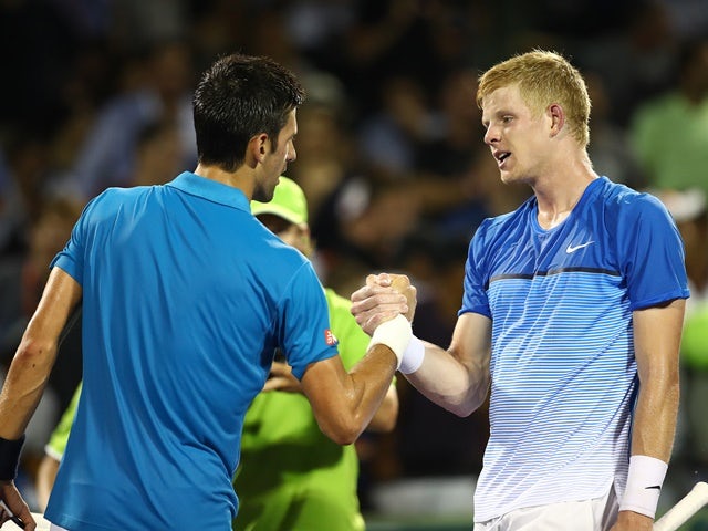 Novak Djokovic shakes hands at the net after his straight-sets victory against Kyle Edmund at the Miami Open on March 25, 2016