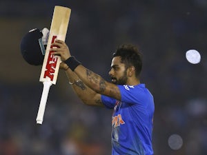 India beat Australia to secure semi-final spot