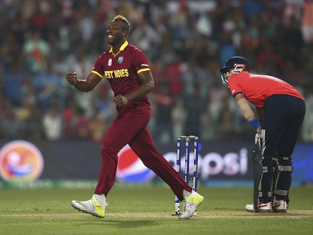 Andre Russell celebrates taking the wicket of Alex Hales during the World Twenty20 final between England and the West Indies at Eden Gardens on April 3, 2016