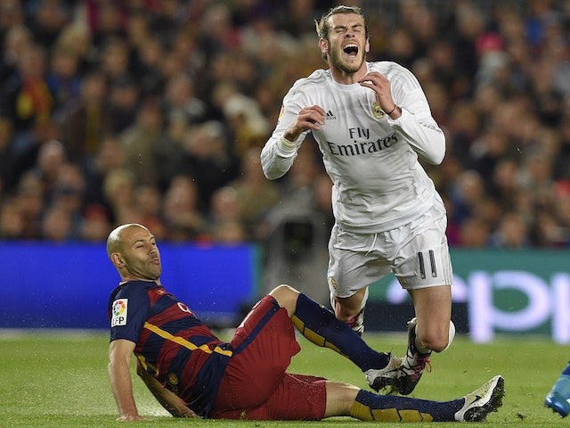 Gareth Bale and Javier Mascherano in action during the La Liga match between Barcelona and Real Madrid on April 2, 2016