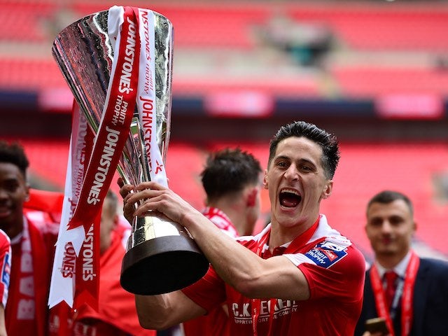 George Williams poses with the trophy after the League Trophy final between Oxford United and Barnsley on April 3, 2016