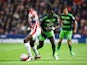 Giannelli Imbula and Bafetimbi Gomis in action during the Premier League match between Stoke City and Swansea City on April 2, 2016