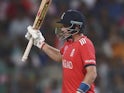 Joe Root celebrates his half century during the World Twenty20 final between England and the West Indies at Eden Gardens on April 3, 2016