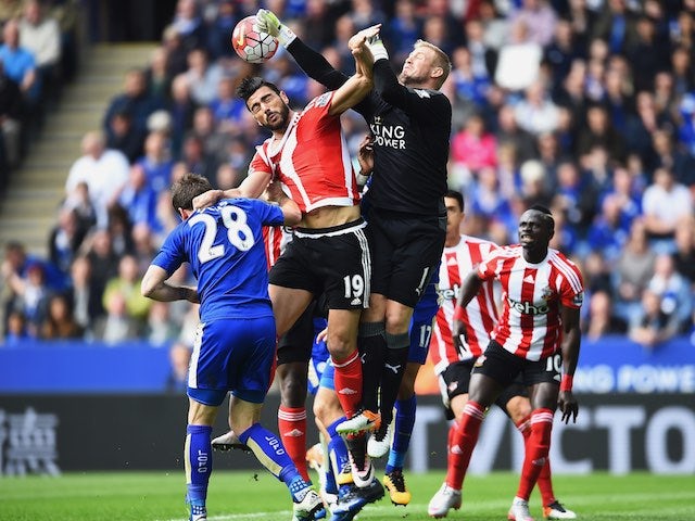 Kasper Schmeichel punches clear Graziano Pelle's effort during the Premier League match between Leicester City and Southampton on April 3, 2016