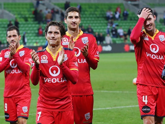 Adelaide United players celebrate winning against Melbourne City on April 8, 2016