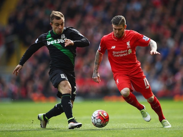 Alberto Moreno and Xherdan Shaqiri in action during the Premier League game between Liverpool and Stoke City on April 10, 2016