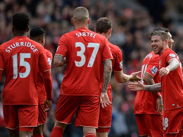 Alberto Moreno celebrates the opener during the Premier League game between Liverpool and Stoke City on April 10, 2016