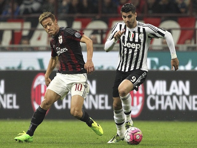 Alvaro Morata and Keisuke Honda in action during the Serie A game between Milan and Juventus on April 9, 2016
