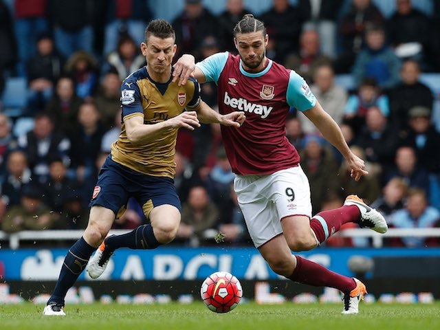 Andy Carroll and Laurent Koscielny in action during the Premier League game between West Ham United and Arsenal on April 9, 2016