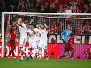 Benfica players react to a missed chance during the Champions League quarter-final between Bayern Munich and Benfica on April 5, 2016