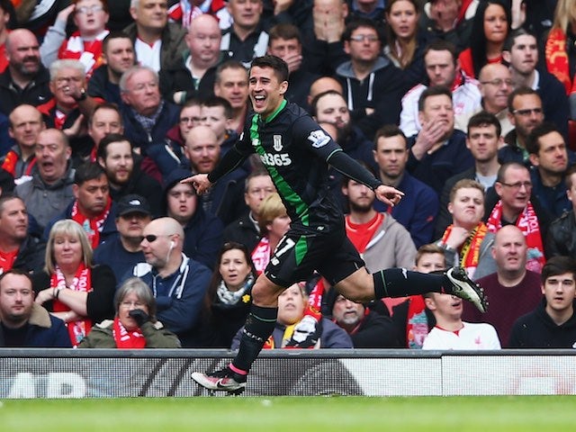 Bojan Krkic celebrates getting an equaliser during the Premier League game between Liverpool and Stoke City on April 10, 2016