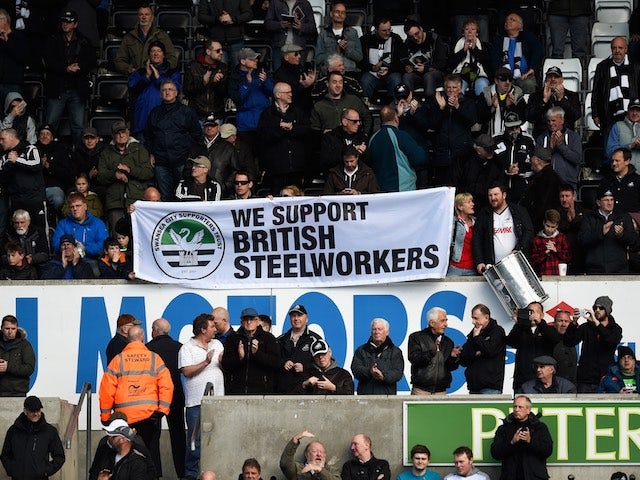 Fans make clear their views on the British steel industry during the Premier League game between Swansea City and Chelsea on April 9, 2016