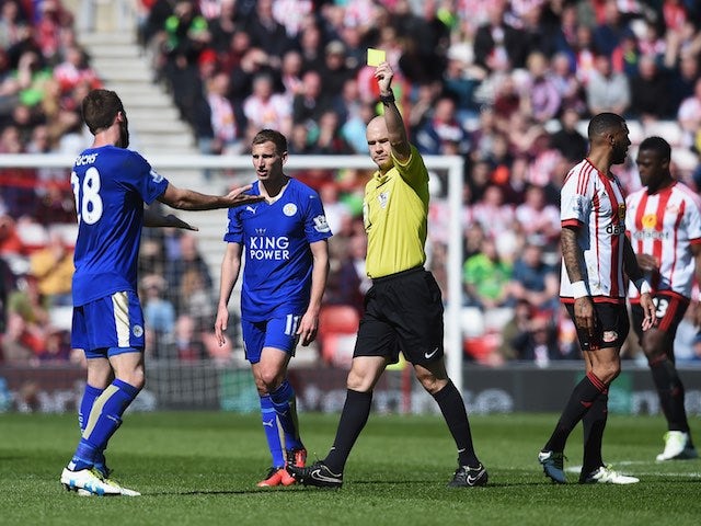 Christian Fuchs receives a yellow card during the Premier League game between Sunderland and Leicester City on April 10, 2016