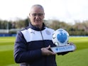 Claudio Ranieri poses with his manager of the month award for March 2016