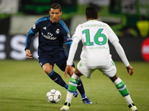 Cristiano Ronaldo takes on Bruno Henrique during the Champions League quarter-final between Wolfsburg and Real Madrid on April 6, 2016