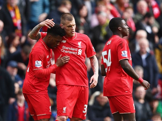 Daniel Sturridge celebrates the second with Martin Skrtel and Sheyi Ojo during the Premier League game between Liverpool and Stoke City on April 10, 2016
