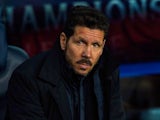 Diego Simeone watches on during the Champions League quarter-final between Barcelona and Atletico Madrid on April 5, 2016