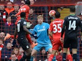 Divock Origi heads past Jakob Haugaard for the third during the Premier League game between Liverpool and Stoke City on April 10, 2016