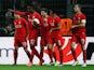 Divock Origi celebrates with teammates after scoring the opener during the Europa League quarter-final between Borussia Dortmund and Liverpool on April 7, 2016