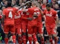 Divock Origi celebrates the fourth goal with teammates during the Premier League game between Liverpool and Stoke City on April 10, 2016