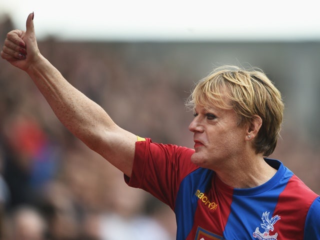 Eddie Izzard presents himself at half time of the Premier League match between Crystal Palace and Norwich City on April 9, 2016