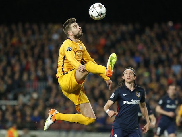 Gerard Pique in a thought-provoking position during the Champions League quarter-final between Barcelona and Atletico Madrid on April 5, 2016