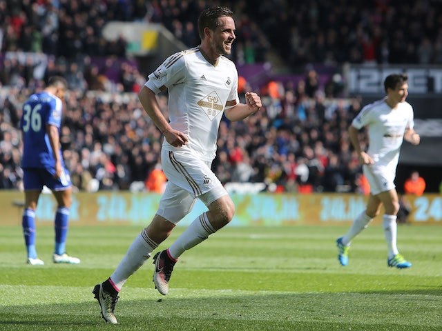 Gylfi Sigurdsson celebrates opening the scoring during the Premier League game between Swansea City and Chelsea on April 9, 2016