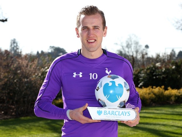 Harry Kane poses with his player of the month award for March 2016